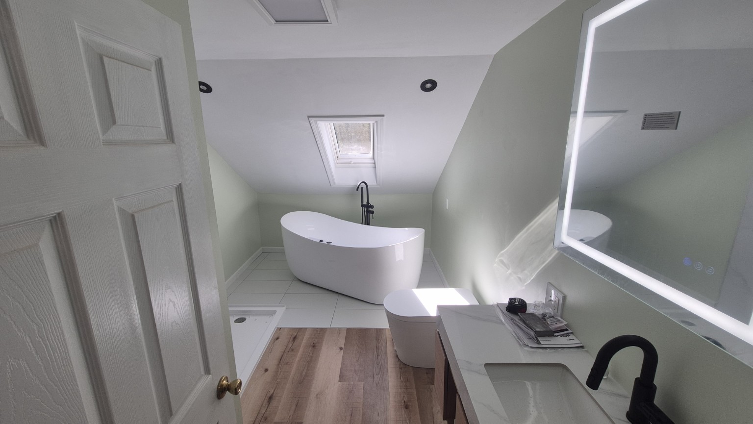 Skylight bathroom by Opulent Builders
